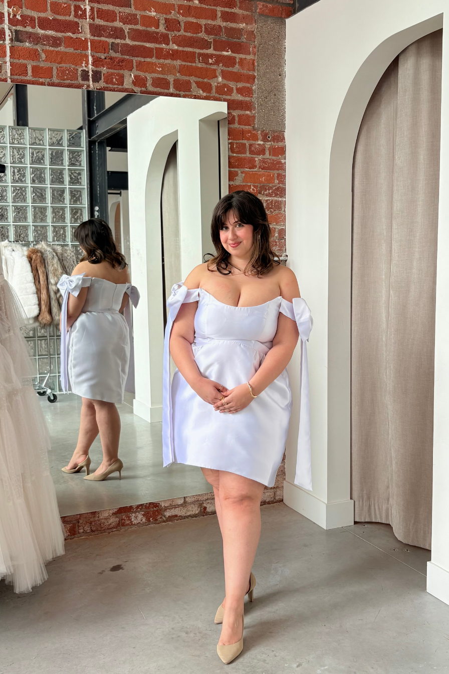 Arabella Bow Dress in White by Bariano - RENTAL